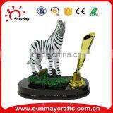 revolving pen holder with zebra figurine