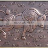 Bronze bull relief sculpture