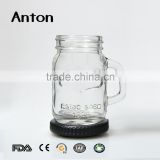 Clear embossed glass mason jar with gold metal lid