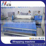 China Foshan NaiGu Factory Semi Automatic Mattress Roll Wrapping Machine thumbnail-4