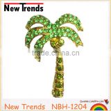 Gold alloy palm tree brooches with green crystal rhinestone