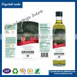 Adhesive waterproof labels for essential glass olive oil bottles