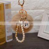 2021 Год Оптовая продажа индивидуально изготовленных роскошных ключей с шерстяными шариками, перловыми ключницами, ключницами с пупырышками и ленточными бантиками для женских сумок. Высокое качество. thumbnail-5