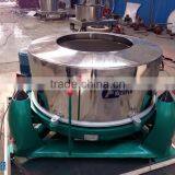Manual feed and discharge type basket centrifuge, basket centrifuge operation