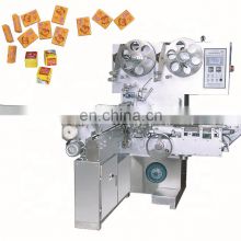 Chocolate coin wrapping machine with embossing machine