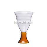 Borosilicate wine glass in amber color with hand cutting