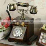 Decorative Antique Telephone With Yellow Flower on Face thumbnail-1