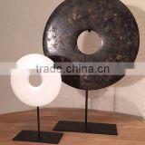 round metal plate with stand sculpture