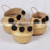 High quality best selling eco-friendly Gold seagrass baskets with black pompoms from Vietnam