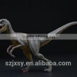 dark brown small Velociraptor toy