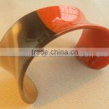 Buffalo horn cuff bracelet with half in orange lacquer