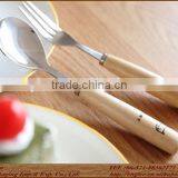 stainless spoon and fork with wooden beech handle