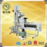 Seed treating machine With Elevator