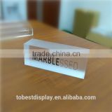 Custom acrylic block display with products brand logo