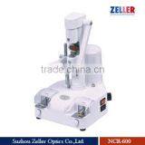 zeller lens driller with notch cutter