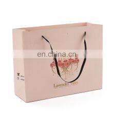 Luxury Custom Logo Gold Foil Printed White Cloth Paper Packaging Bag With Handle thumbnail-1