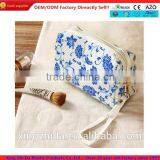 Blue and White Diamond Pattern Cosmetic Bag in Hand thumbnail-1