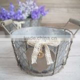 round metal flower pot stand with wooden heart button and ribbon