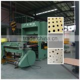 Gypsum board perforating machine