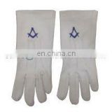 A pair of cotton gloves with an embroidered square and compass motif in Light Blue