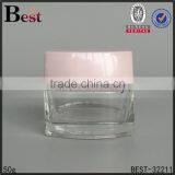 China Cosmetics 50 ml Glass Jar Clear Transparent Square Glass Jar With Pink Cap Manufacture thumbnail-1