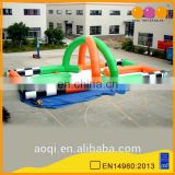 AOQI commercial use inflatable interactive race track sports game for sale