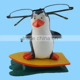 resin penguin eyeglasses stand statue