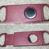 red plastic cigar cutter