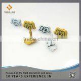 Metal Yellow Dog Brads thumbnail-1