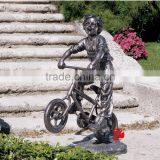 Bronze Cute Boy Statue by Bike Playing in Backyard thumbnail-1
