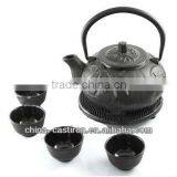cast iron tea pot with cups