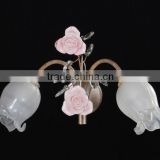 Beautiful glass shade wrought iron sconce light in wall