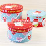 Colorful round hat gift paper box with rope handle