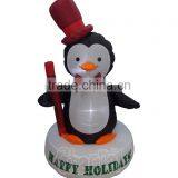 Happy Holidays Living Inflatable Baby Penguin With Top Red Hat Standing on Pedestal thumbnail-1