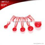 Round plastic red color measuring spoon