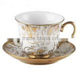 plated porcelain tea cup and saucer