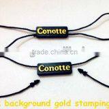 2015 Wholesale Good Price of Gold Stamping Word Plastic Seal Tag for Clothing