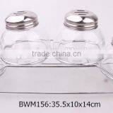 4pcs Round Glass Spice Jars With Metal Lid on a Metal Rack