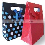 Paper gift bag with ribbon decoration handle