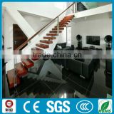 Floating wood staircase with wire railing