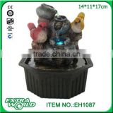 resin craftwork water fountain with colorful bird
