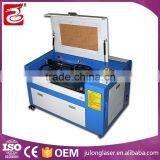 low price high speed co2 laser cutter jigsaw puzzle laser cutting machine for small business
