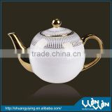 elegant porcelain tea pot in golden design