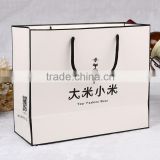 High quality white kraft paper bag with black logo clothing paper bag