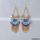 gold disc with colorful bead and gold tassel earrings