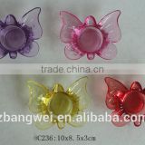 butterfly-shaped glass candle holder