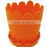 Orange Plastic Pot With Attached Saucer