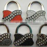 the Newest and Hot Sell Bag Promotion Top Quality Metal Bag Shaped Purse Bag Hanger Table Bag Hook Hanger