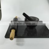 Polished black marble rolling pin and marble pastry board
