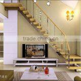 Indoor Stair Design With Wood Tread and Glass Railing